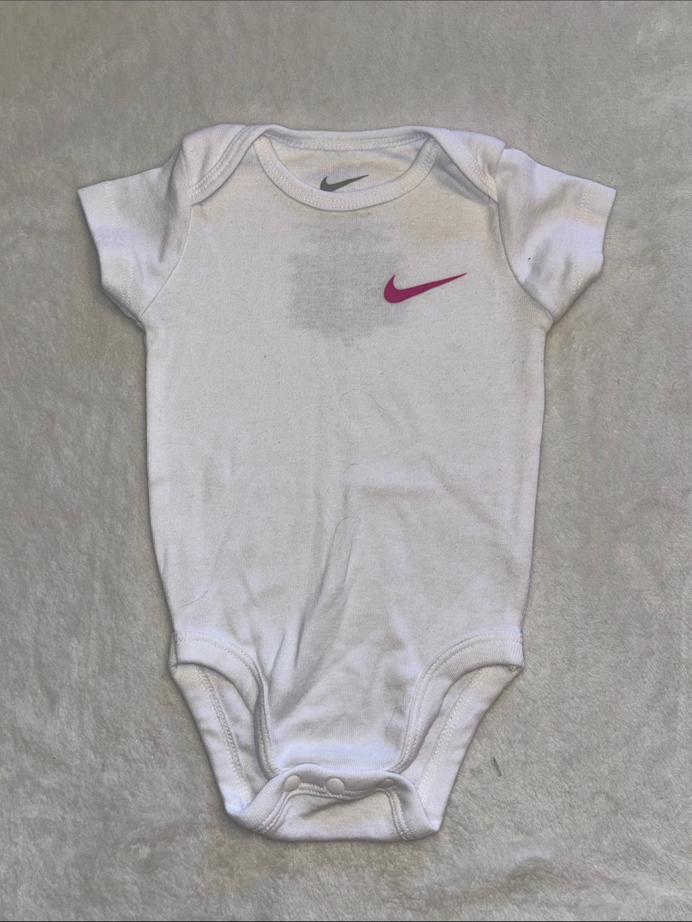 Nike White Baby Bodysuit with Pink Swoosh